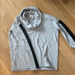 Barney’s sweater with leather